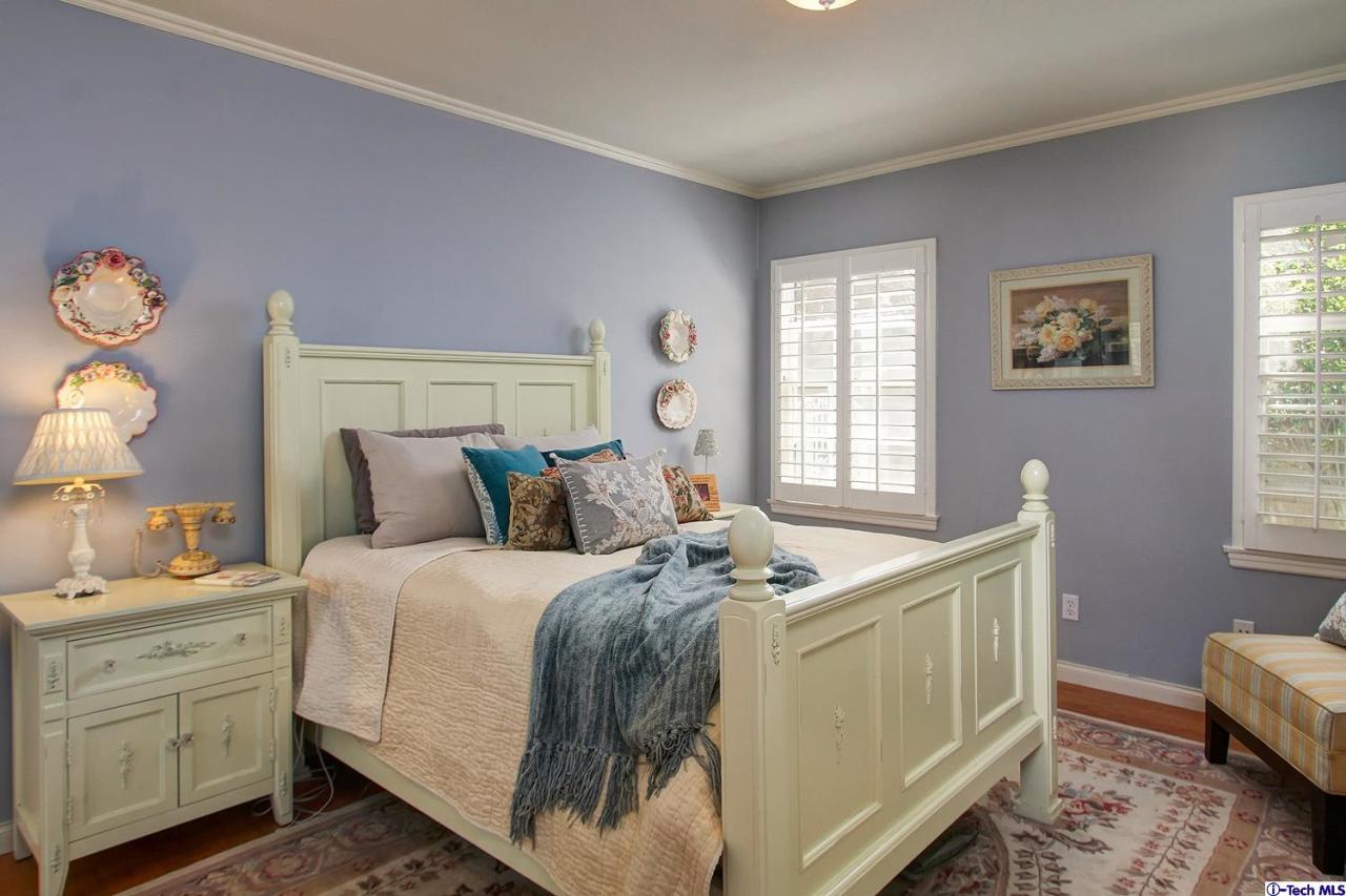 931 Roxbury Road San Marino, CA 91108 - Photo 26 of 37 a bed room with a bed and a window
