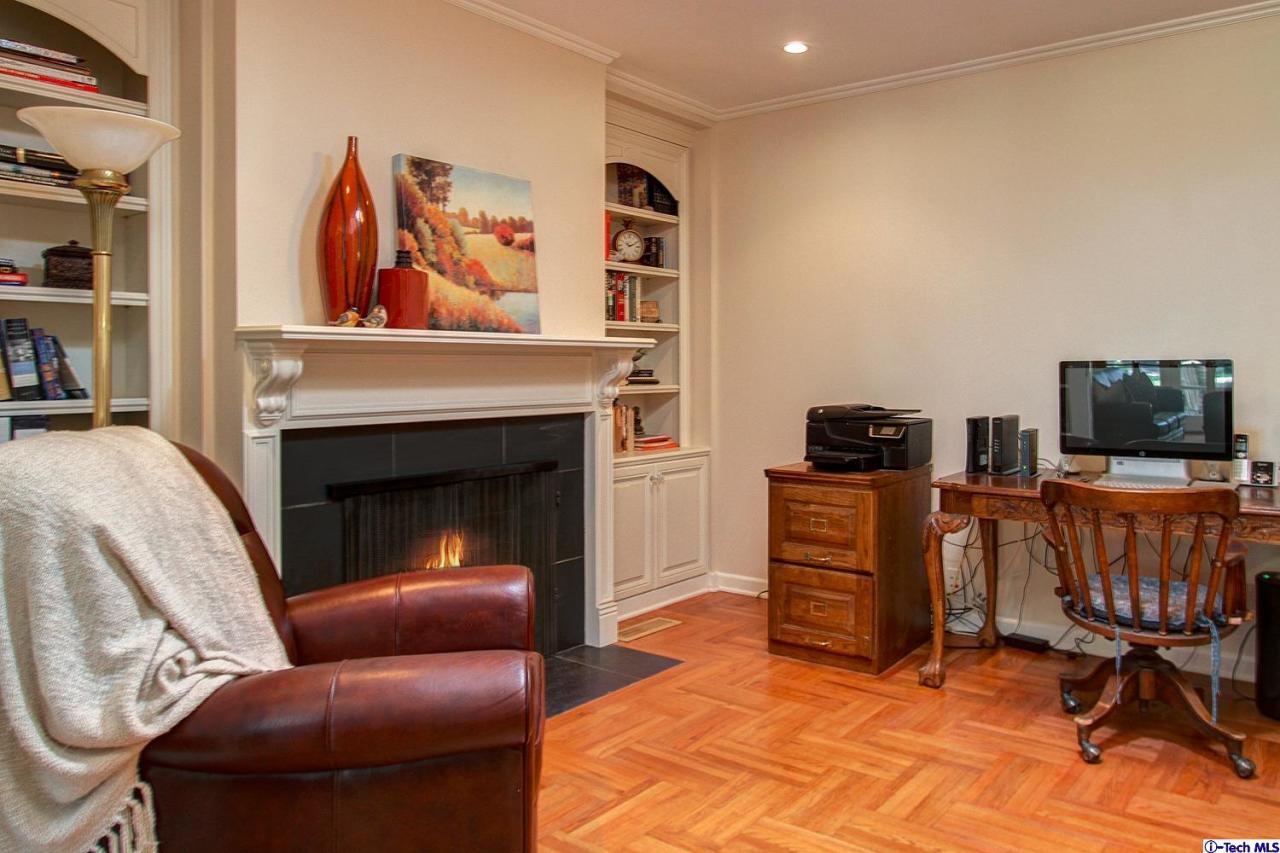 931 Roxbury Road San Marino, CA 91108 - Photo 28 of 37 a living room with furniture a flat screen tv and a fireplace