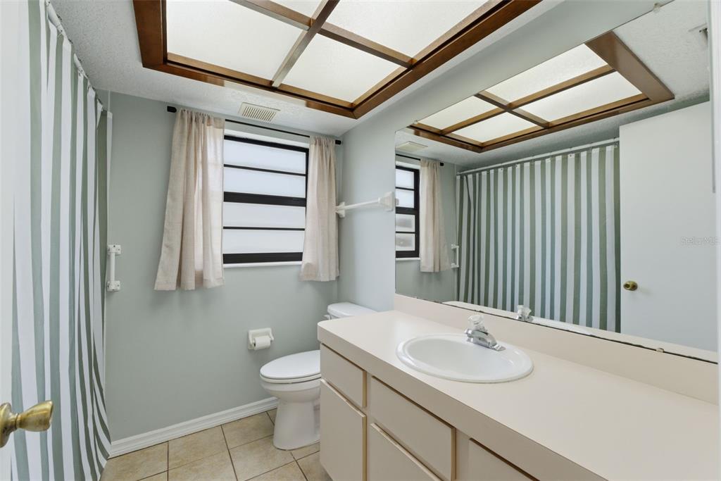 4966 Keysville Avenue Spring Hill, FL 34608 - Photo 35 of 48 a bathroom with a sink toilet and shower