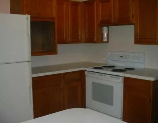 a kitchen with a sink dishwasher and cabinets