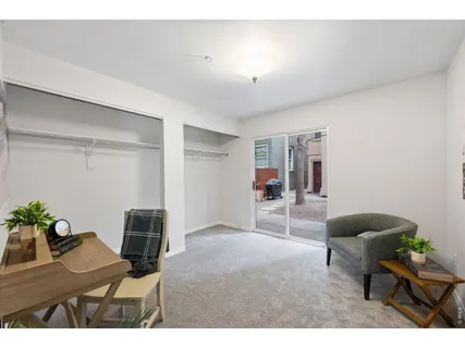 a living room with furniture and a chair
