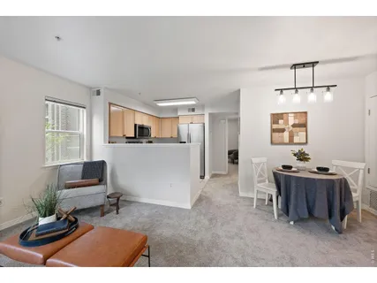 a kitchen with stainless steel appliances granite countertop a sink and a white cabinets