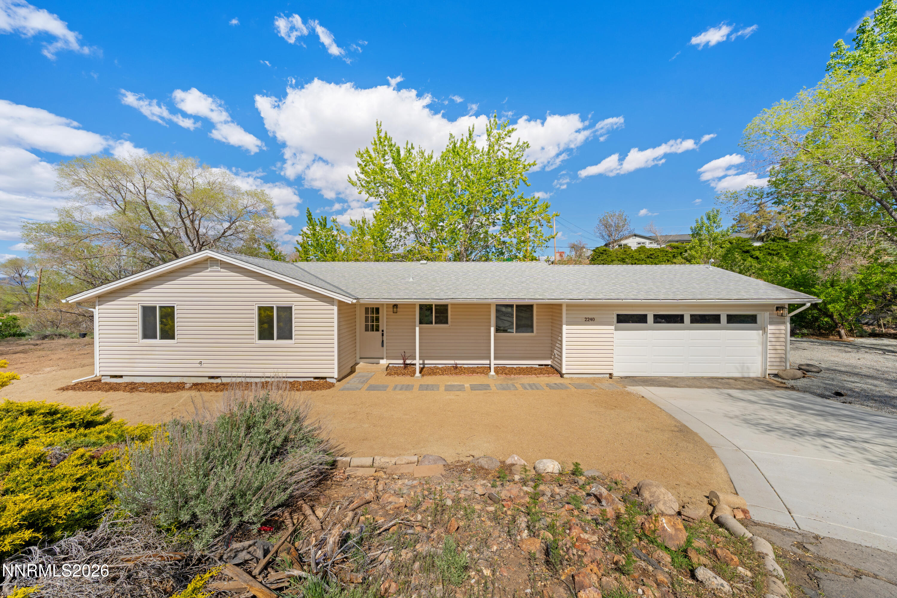 2240 Osceola Court Reno, NV 89506 - Photo 1 of 31 a house with trees in the background