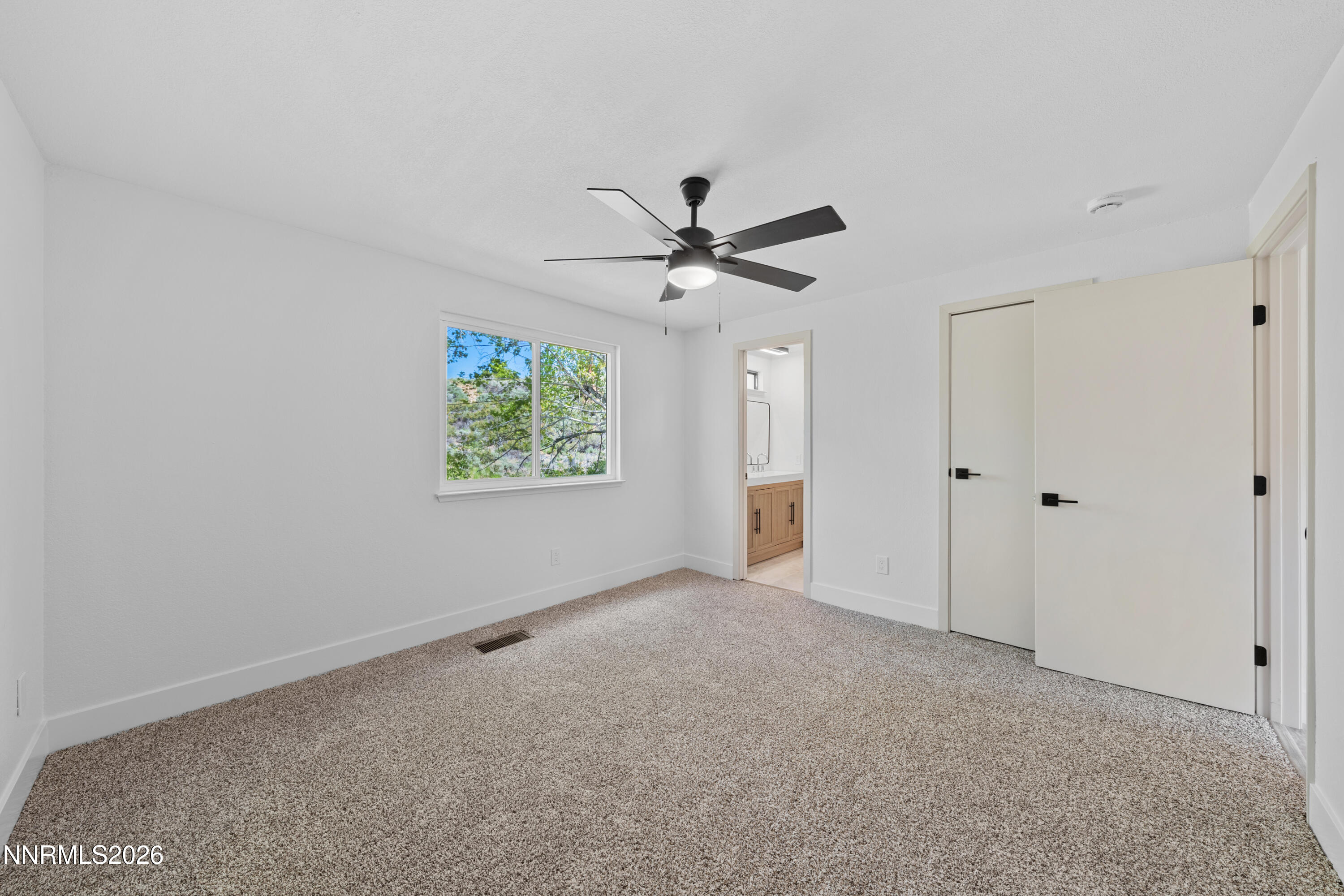 2240 Osceola Court Reno, NV 89506 - Photo 14 of 31 an empty room with windows and ceiling fan