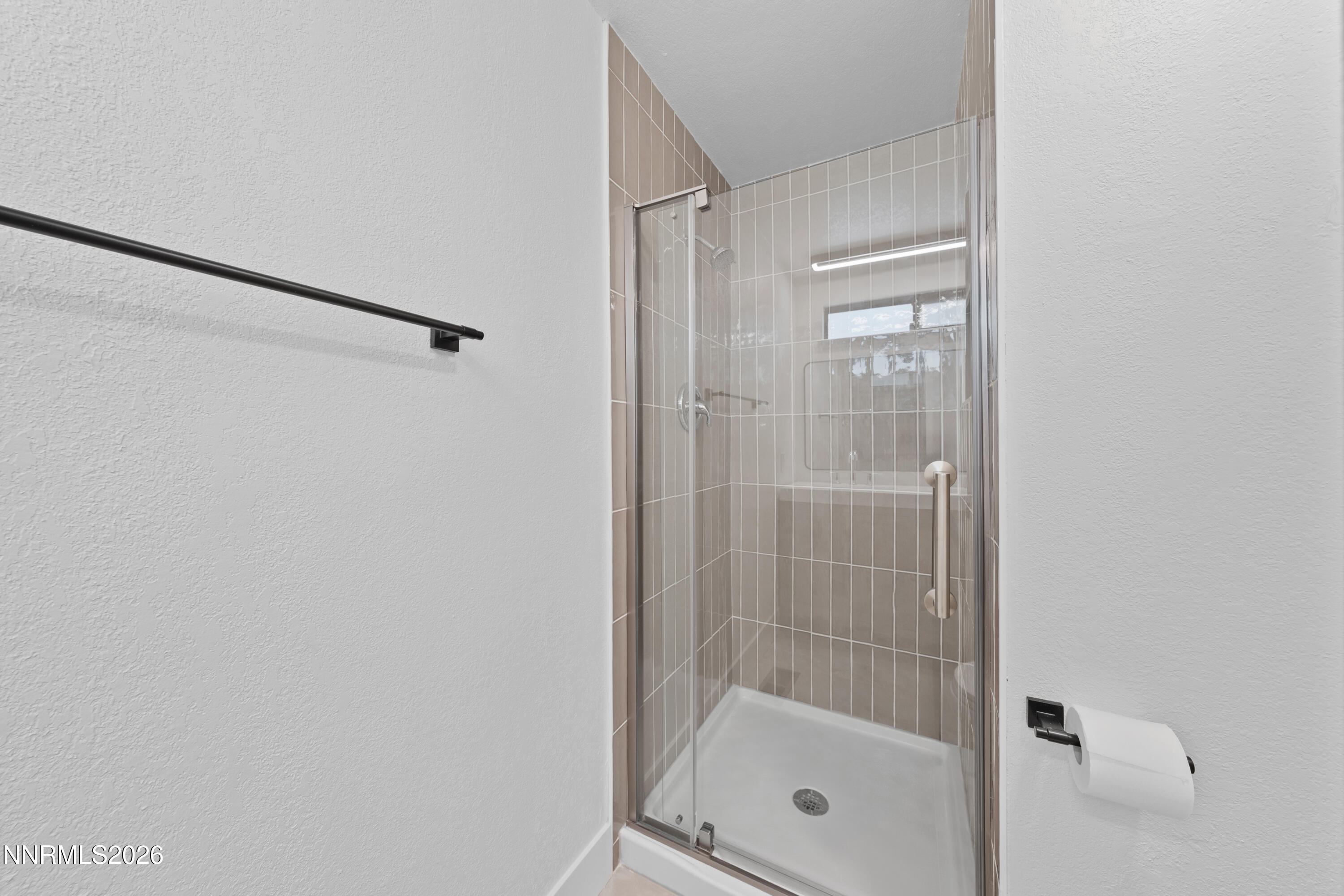 2240 Osceola Court Reno, NV 89506 - Photo 16 of 31 a bathroom with a glass shower door