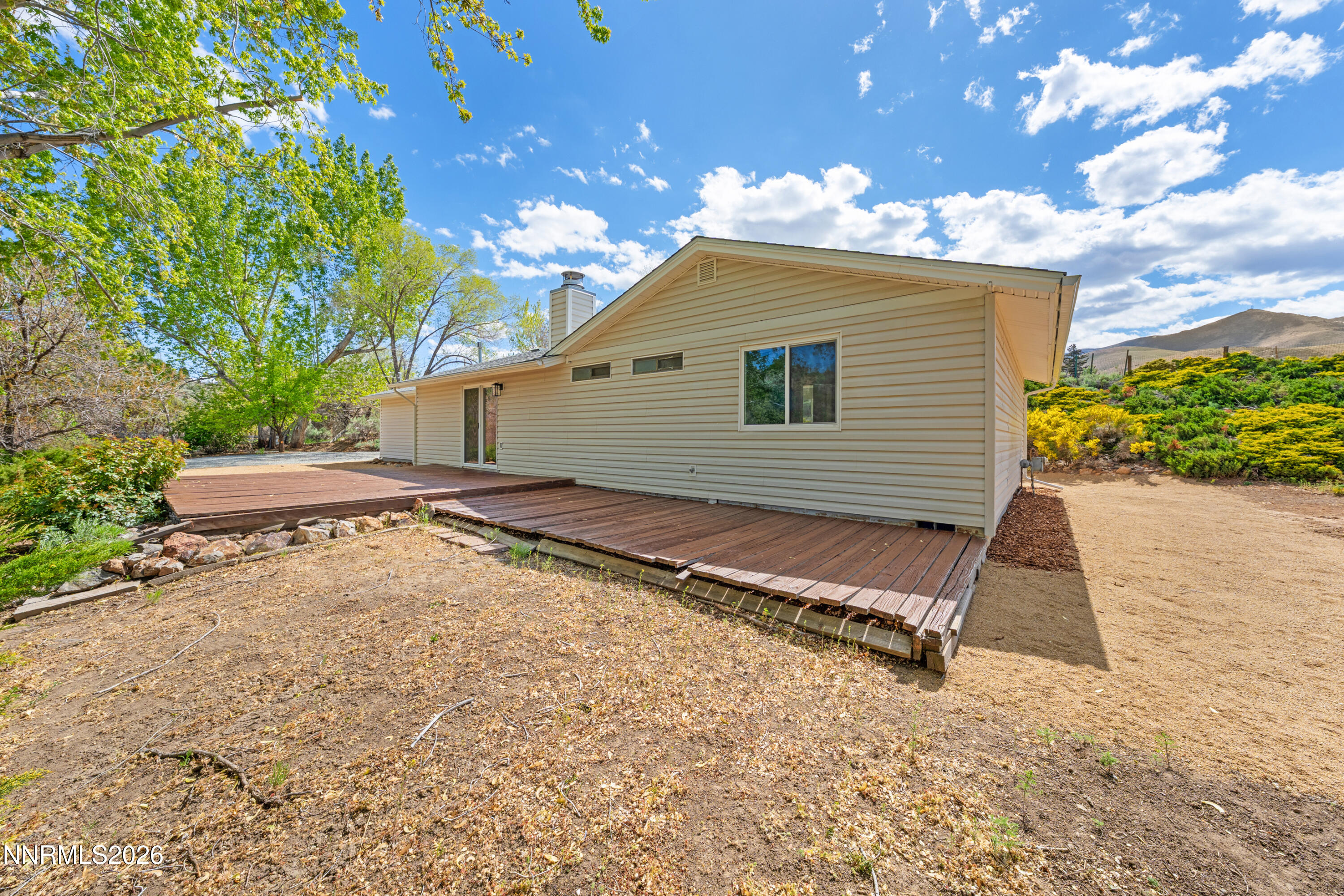 2240 Osceola Court Reno, NV 89506 - Photo 21 of 31 a back view of a house with a yard