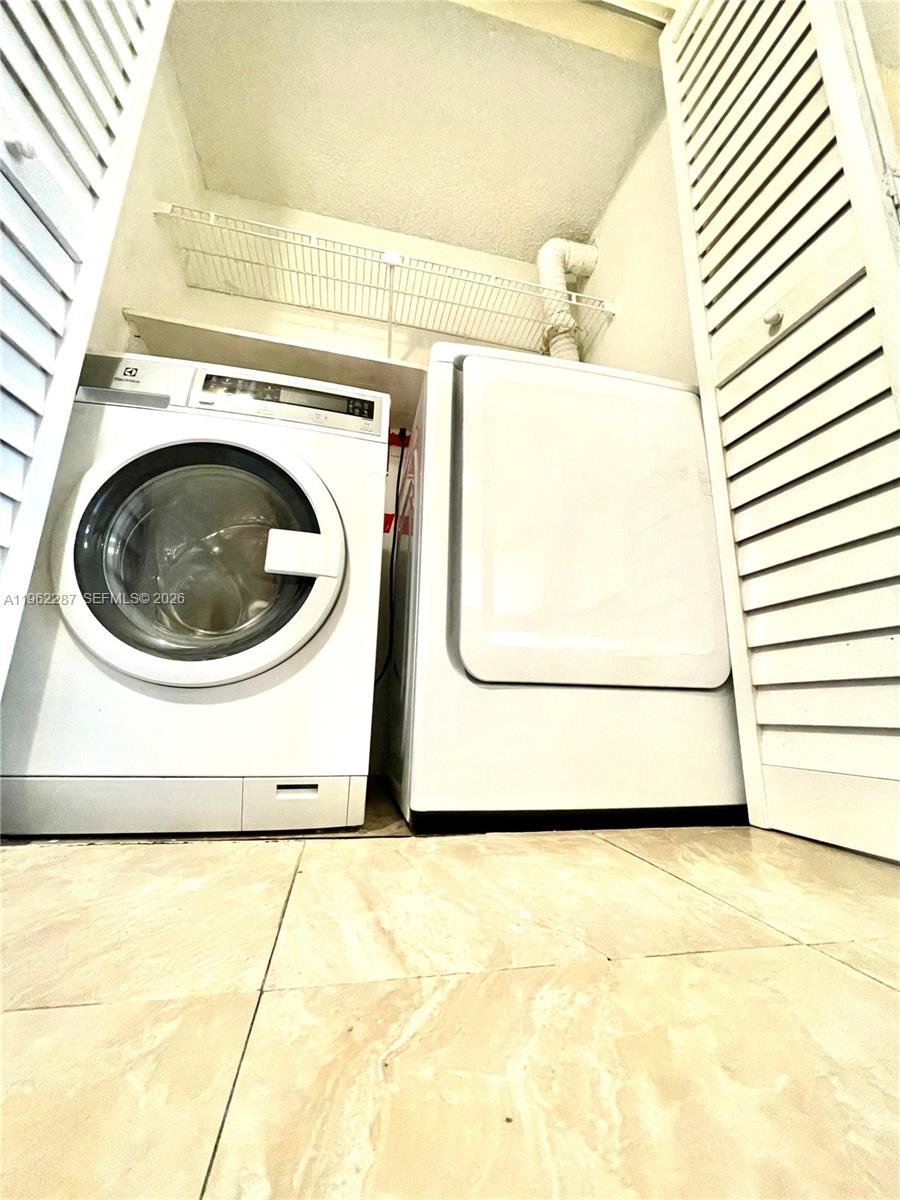 3690 North 56th Avenue, Unit 921 Hollywood, FL 33021 - Photo 16 of 41 a utility room with a washer and dryer