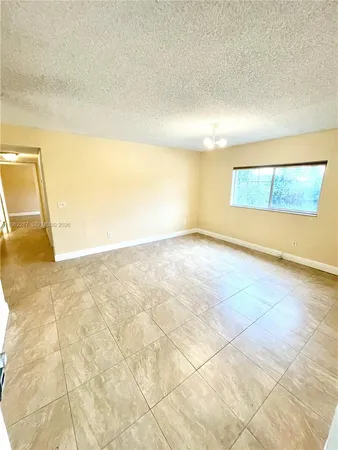 a view of a big room with wooden floor