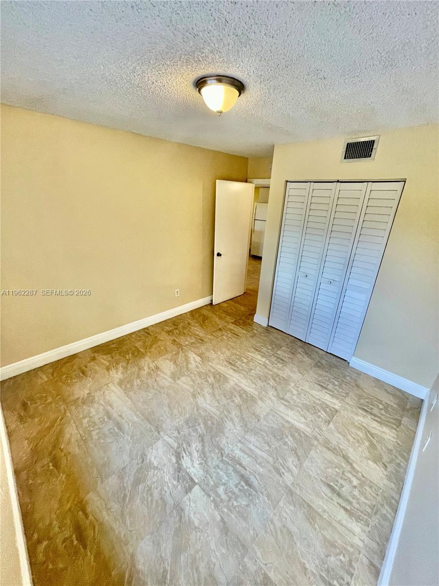 3690 North 56th Avenue, Unit 921 Hollywood, FL 33021 - Photo 21 of 41 a view of an empty room