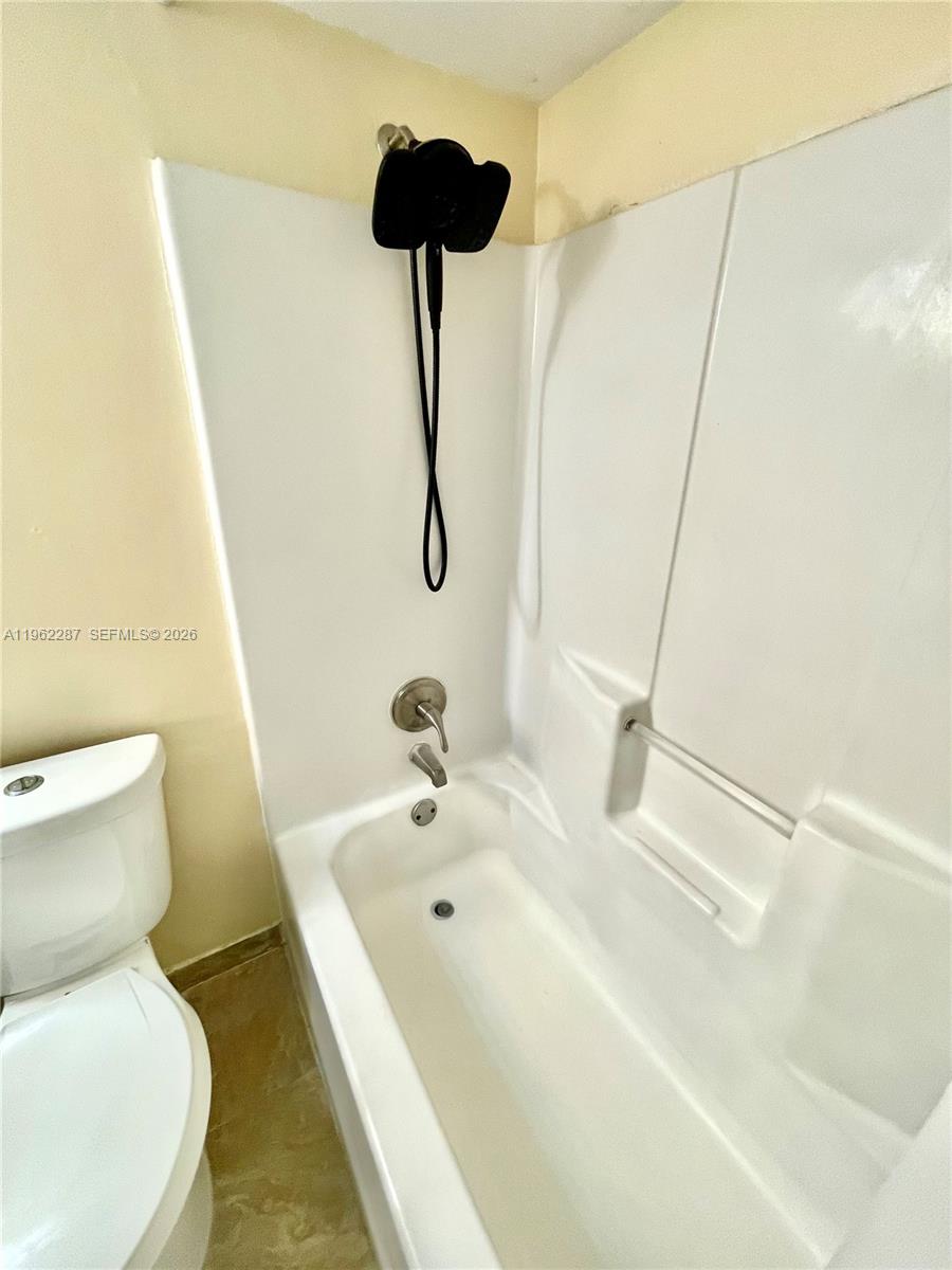 3690 North 56th Avenue, Unit 921 Hollywood, FL 33021 - Photo 23 of 41 a bathroom with a sink and a toilet