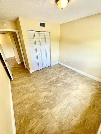 a view of a big room with wooden floor