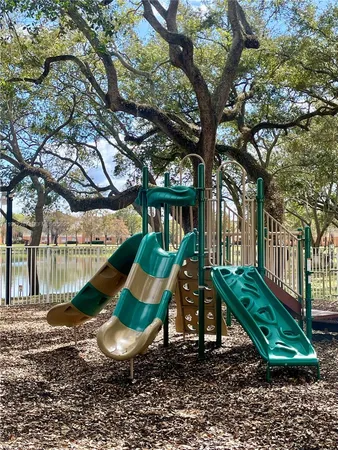 a view of a house with swimming pool and mountains in the background