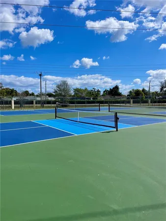 a view of a swimming pool with an outdoor space and seating area