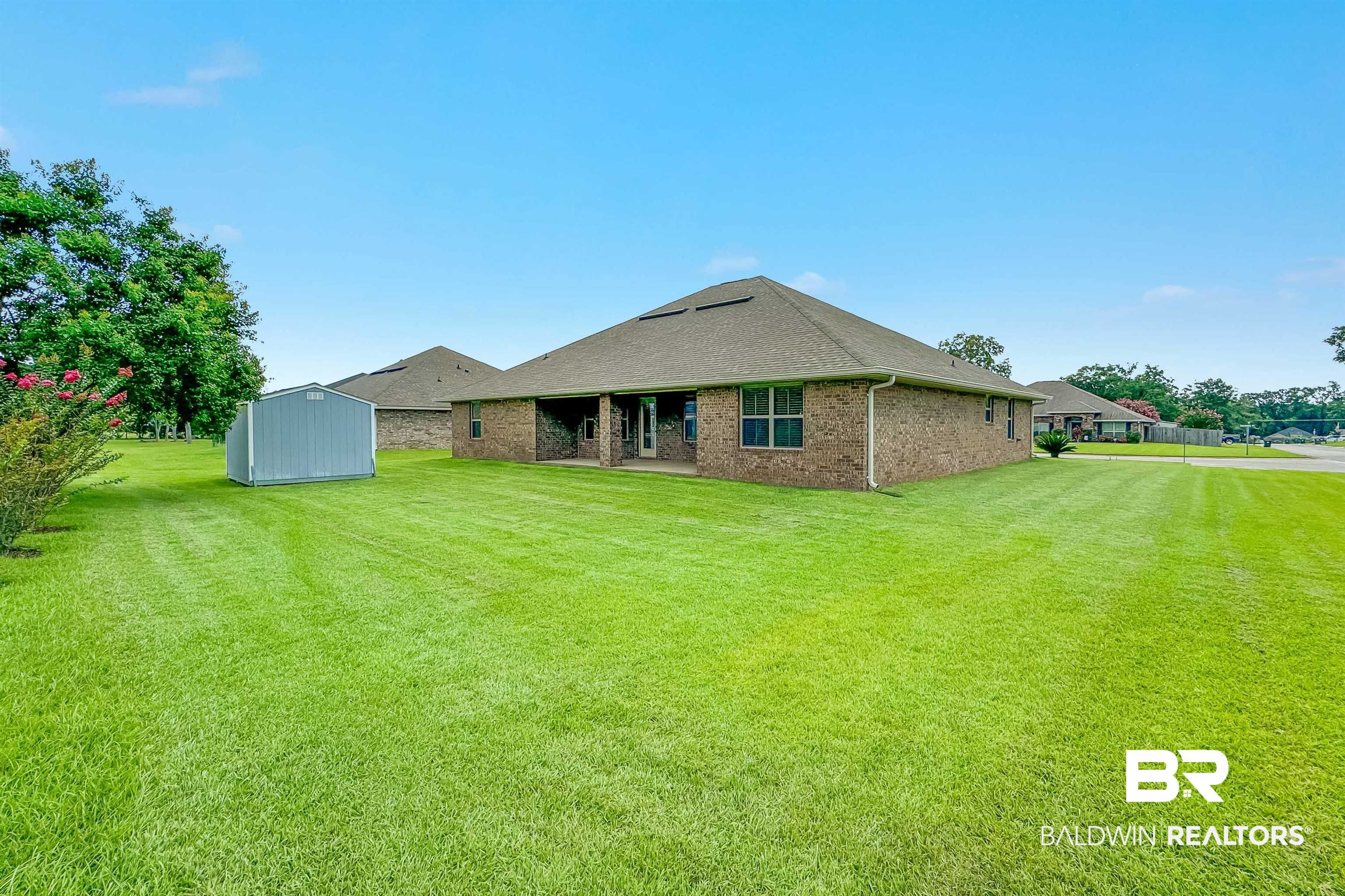 13155 Wishbone Court Foley, AL 36535 - Photo 32 of 39 Exterior space with a storage shed and a lawn