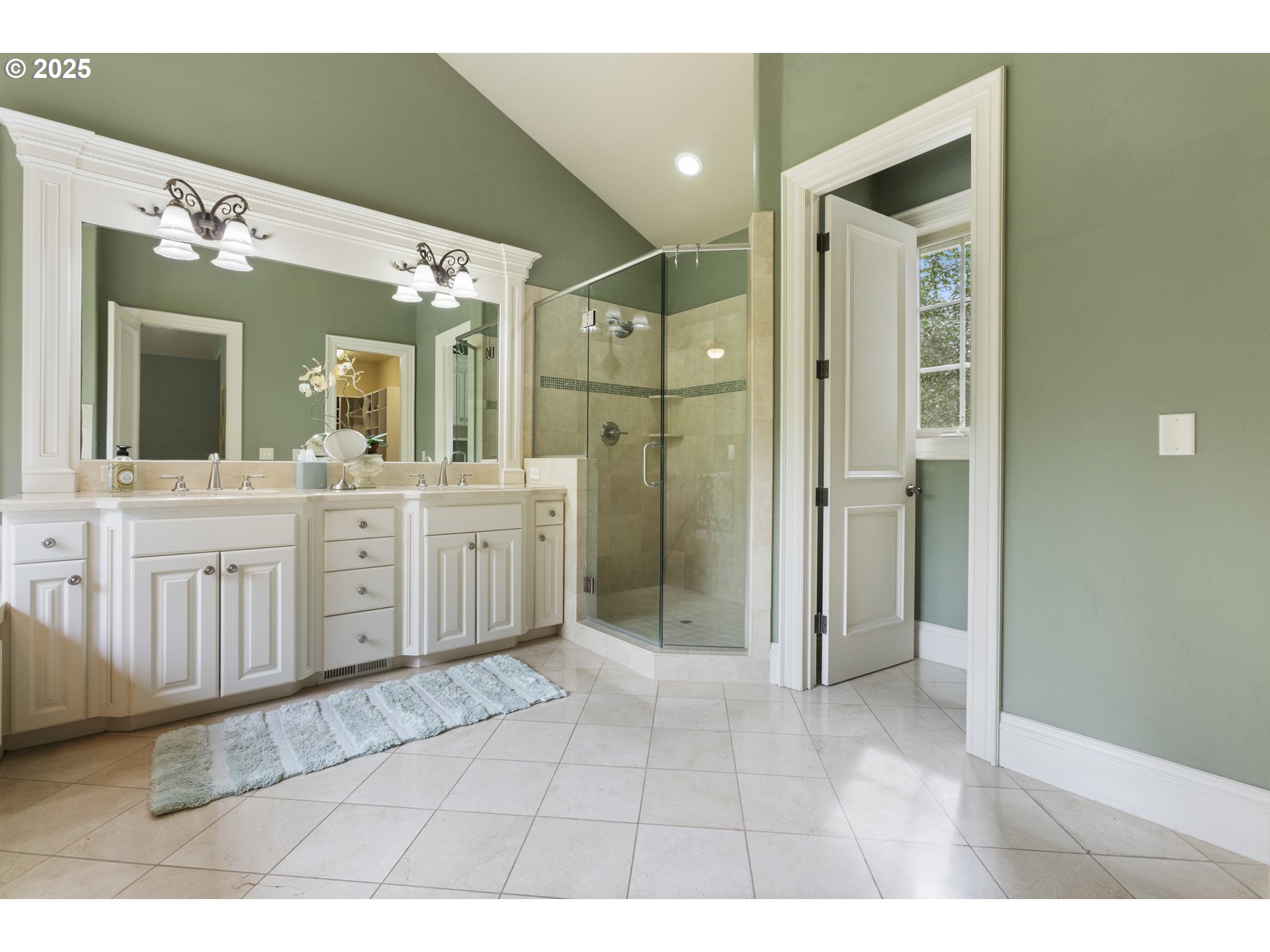 24800 Southwest Big Fir Road West Linn, OR 97068 - Photo 22 of 48 a spacious bathroom with a shower a sink and a mirror