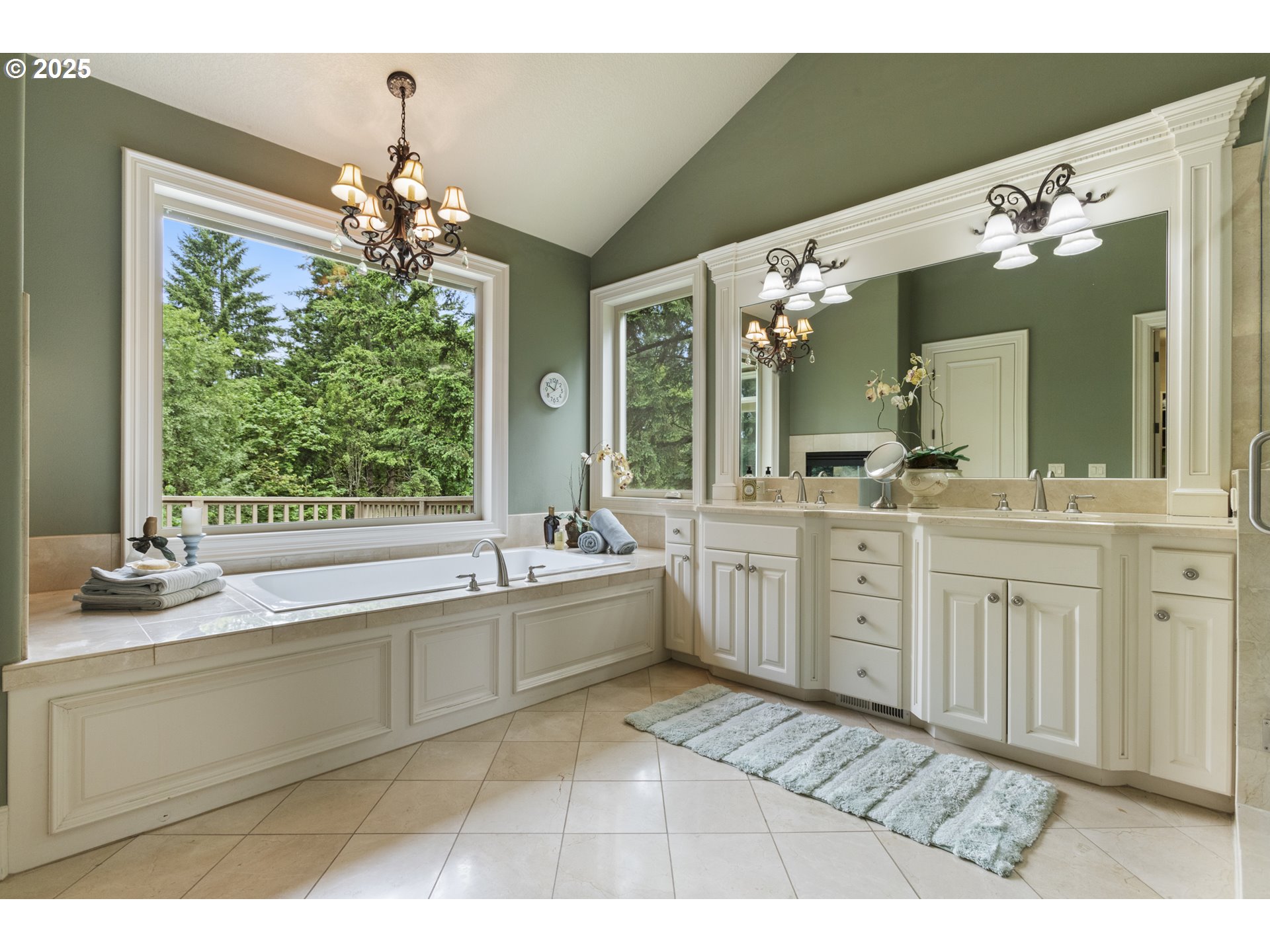 24800 Southwest Big Fir Road West Linn, OR 97068 - Photo 23 of 48 a spacious bathroom with a sink mirror and a bathtub next to a window