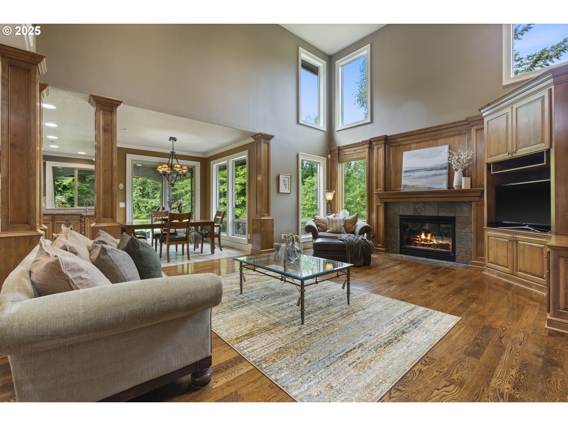 24800 Southwest Big Fir Road West Linn, OR 97068 - Photo 3 of 48 a living room with furniture wooden floor and a fireplace