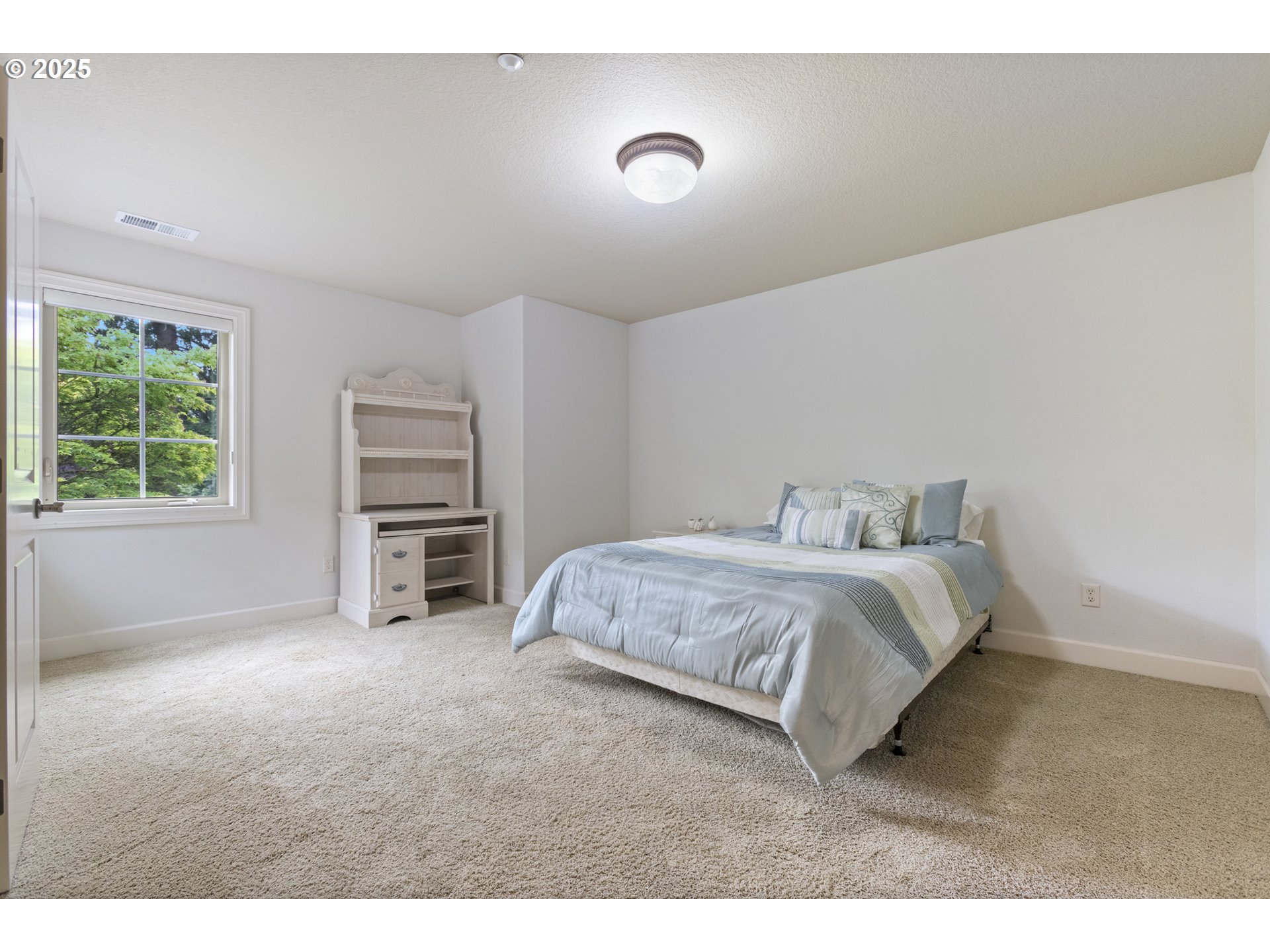 24800 Southwest Big Fir Road West Linn, OR 97068 - Photo 31 of 48 a spacious bedroom with a bed and a cabinets