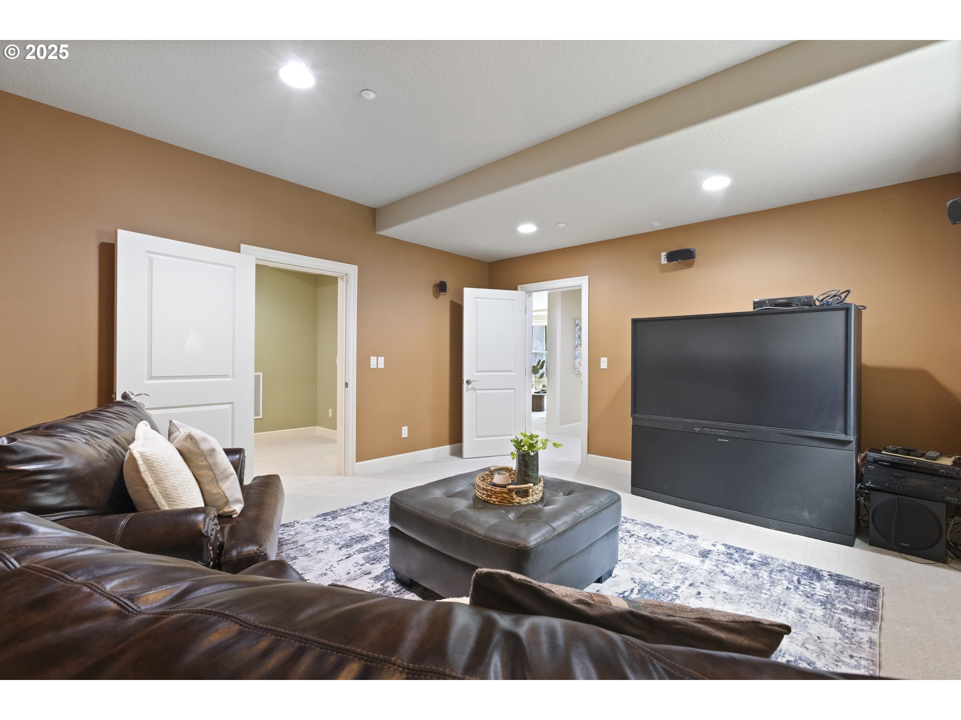 24800 Southwest Big Fir Road West Linn, OR 97068 - Photo 32 of 48 a living room with furniture and a flat screen tv