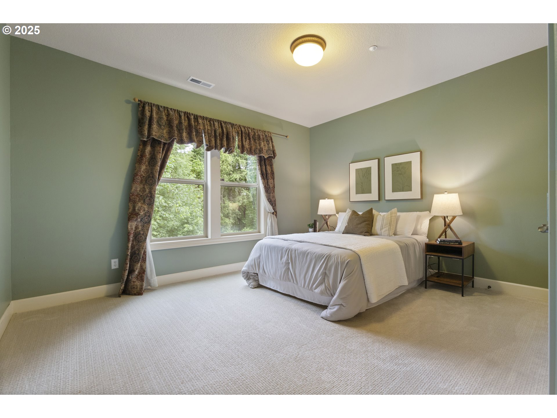 24800 Southwest Big Fir Road West Linn, OR 97068 - Photo 37 of 48 a spacious bedroom with a bed and a large window