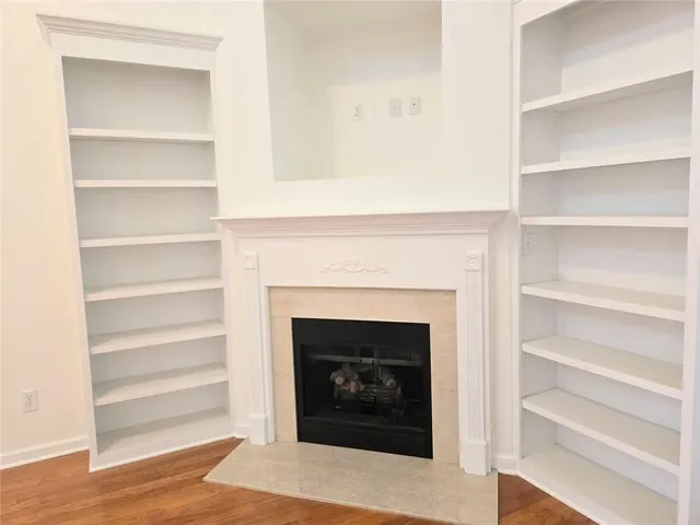 a kitchen with stainless steel appliances granite countertop a refrigerator stove and microwave