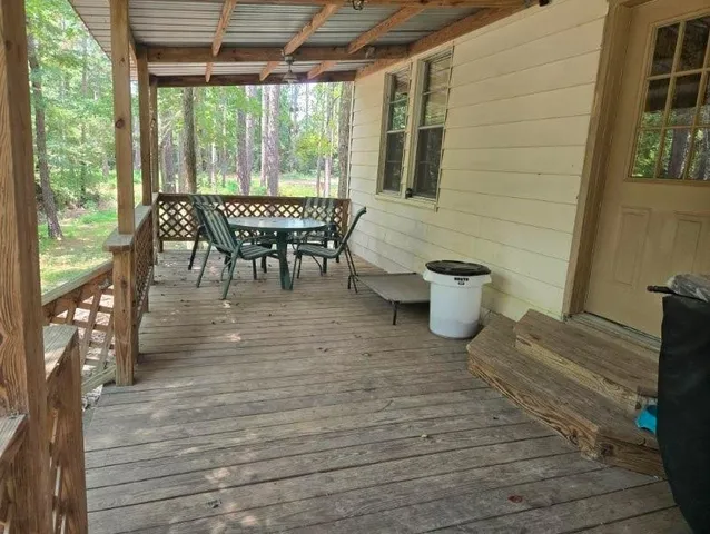 a view of a patio with a table and chairs