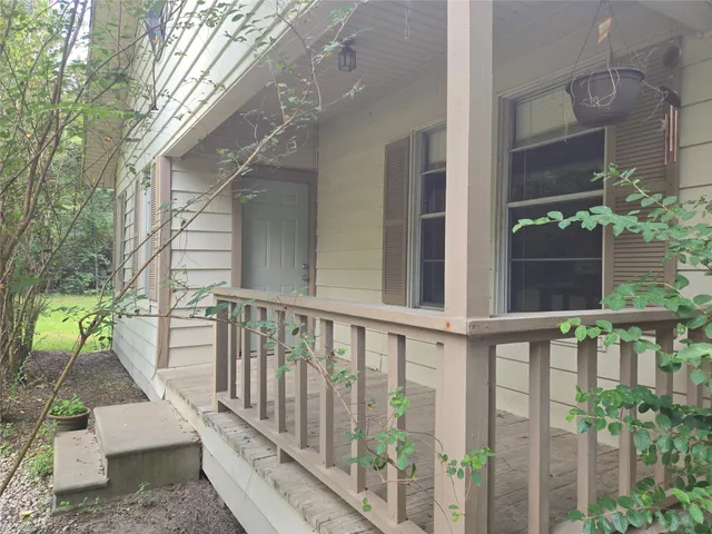 a view of a porch with a bench