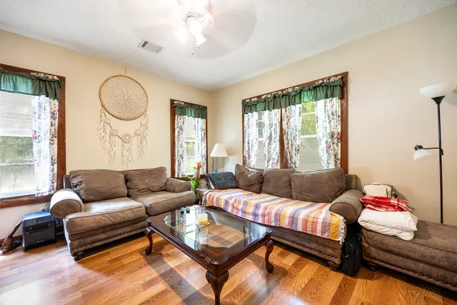 a living room with furniture and a large window