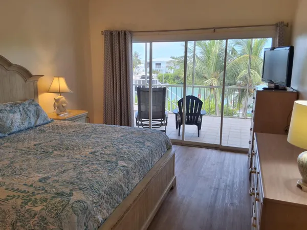 a bedroom with a bed and a night stand