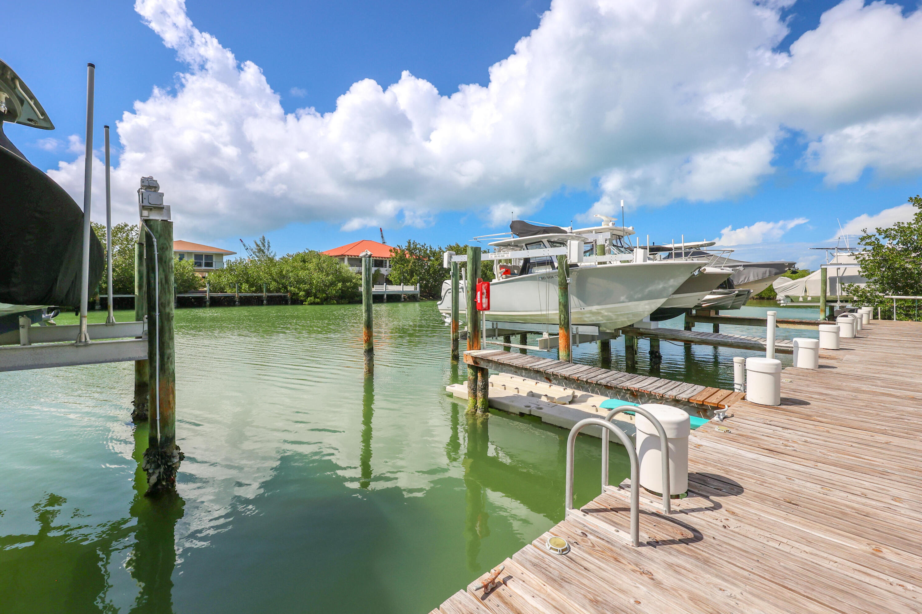 1 Ave F Marathon, FL 33050 - Photo 27 of 36 a balcony with view of lake and residential houses with outdoor space