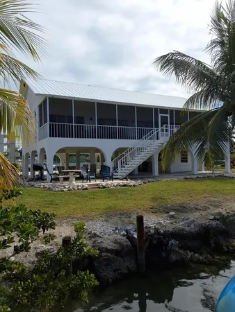 a front view of house with garden