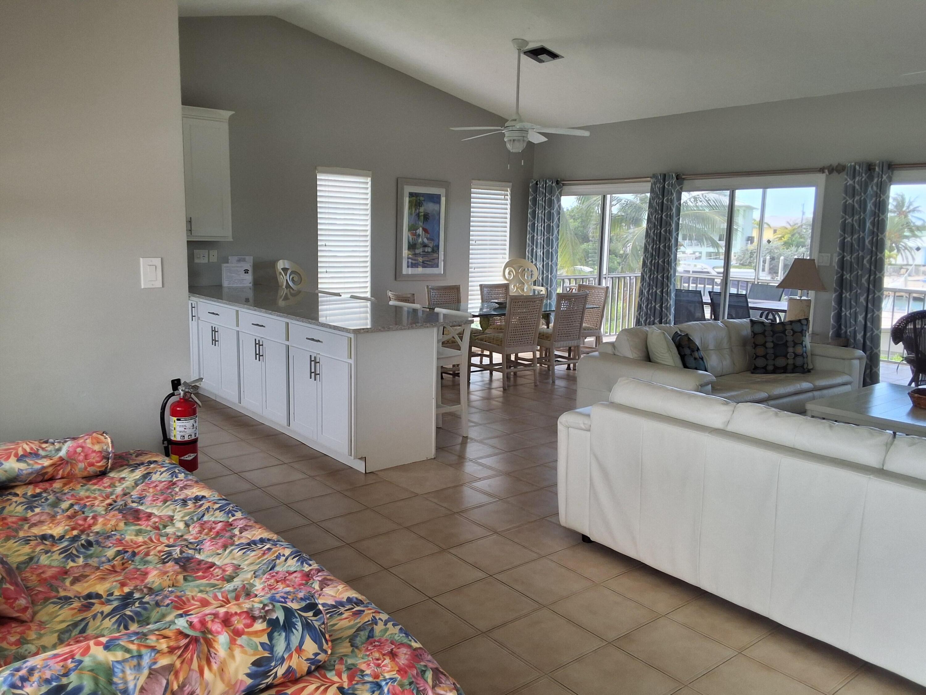 1 Ave F Marathon, FL 33050 - Photo 6 of 36 a living room with furniture and a chandelier
