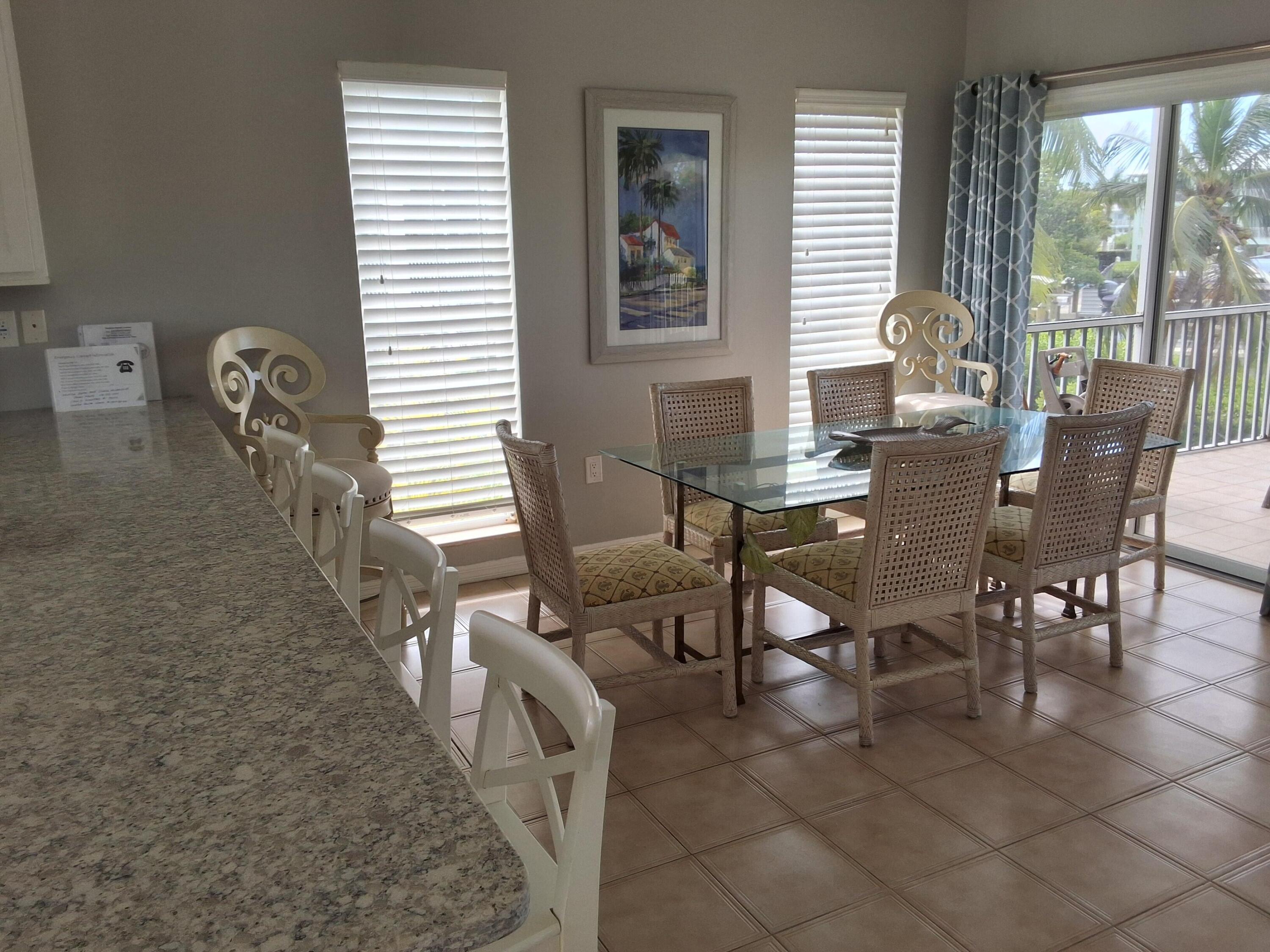 1 Ave F Marathon, FL 33050 - Photo 10 of 36 a view of a dining room with furniture and wooden floor
