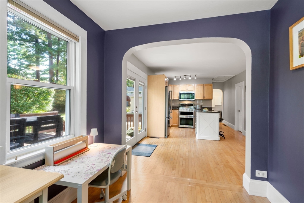 6 Grove Avenue Sharon, MA 02067 - Photo 11 of 27 a large kitchen with stainless steel appliances granite countertop a stove and a refrigerator