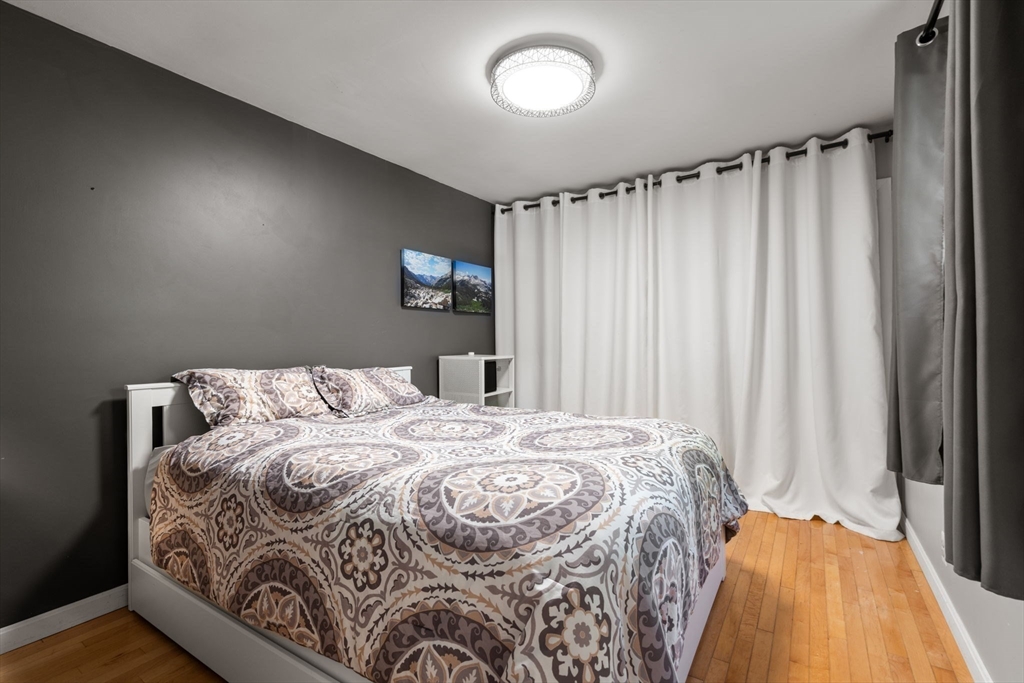 6 Grove Avenue Sharon, MA 02067 - Photo 13 of 27 a bedroom with a bed and a mirror