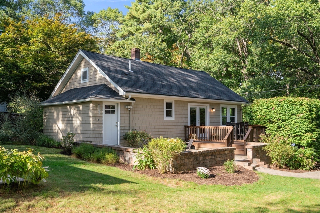 6 Grove Avenue Sharon, MA 02067 - Photo 2 of 27 a front view of house with yard and trees in the background
