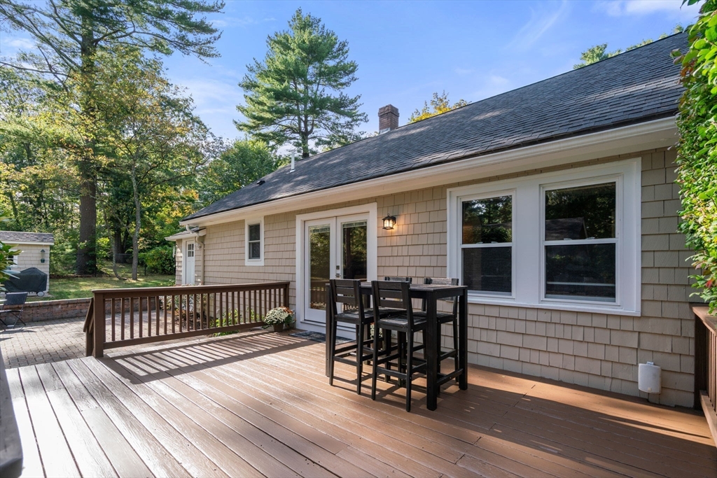 6 Grove Avenue Sharon, MA 02067 - Photo 21 of 27 a view of a house with wooden deck and furniture