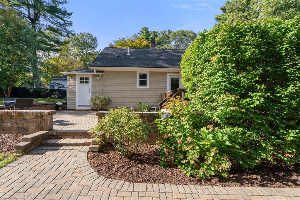 6 Grove Avenue Sharon, MA 02067 - Photo 23 of 27 a view of a house with a yard and plants