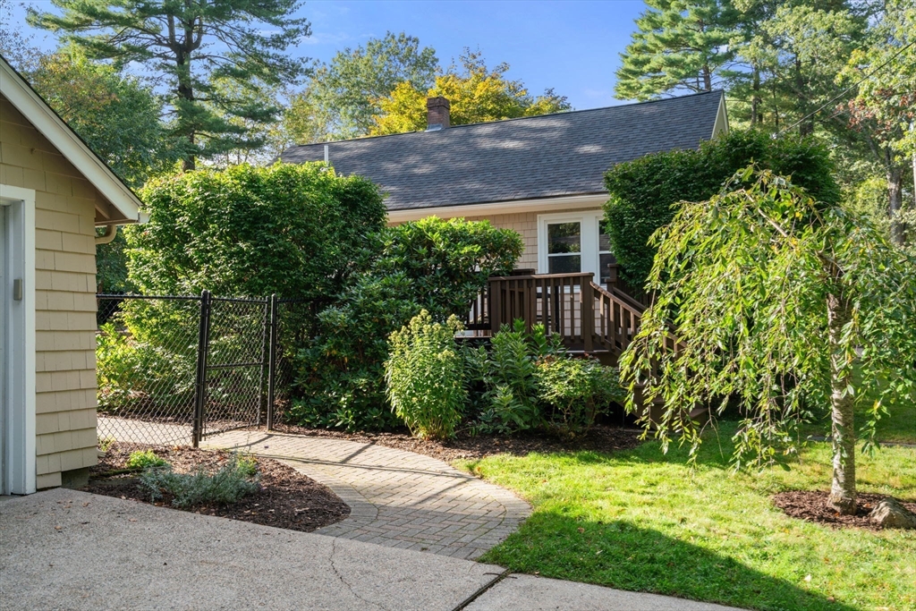 6 Grove Avenue Sharon, MA 02067 - Photo 25 of 27 a view of a house with a yard and plants