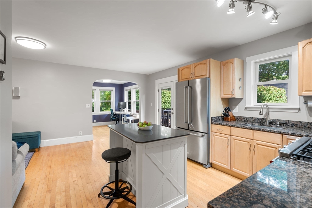 6 Grove Avenue Sharon, MA 02067 - Photo 6 of 27 a kitchen with stainless steel appliances granite countertop a sink a stove and refrigerator