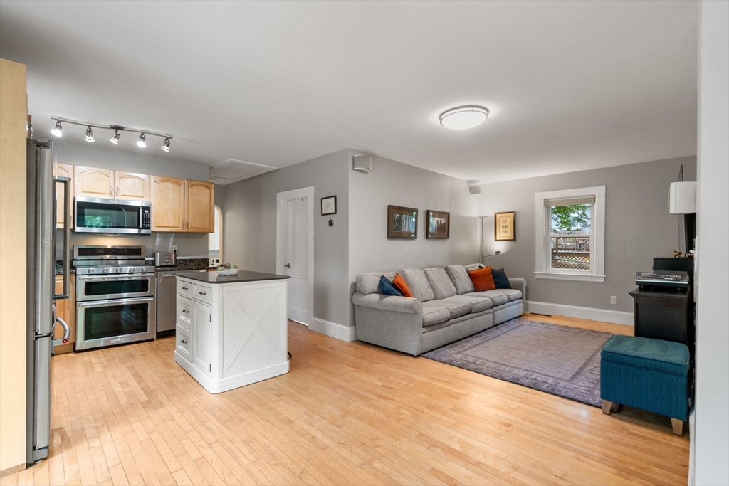 6 Grove Avenue Sharon, MA 02067 - Photo 8 of 27 a living room with furniture and kitchen view