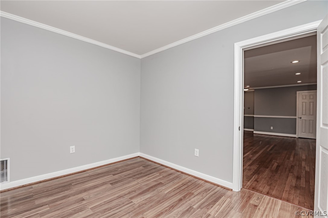 3825 West Hundred Road Chester, VA 23831 - Photo 13 of 30 a view of a room with wooden floor and a window