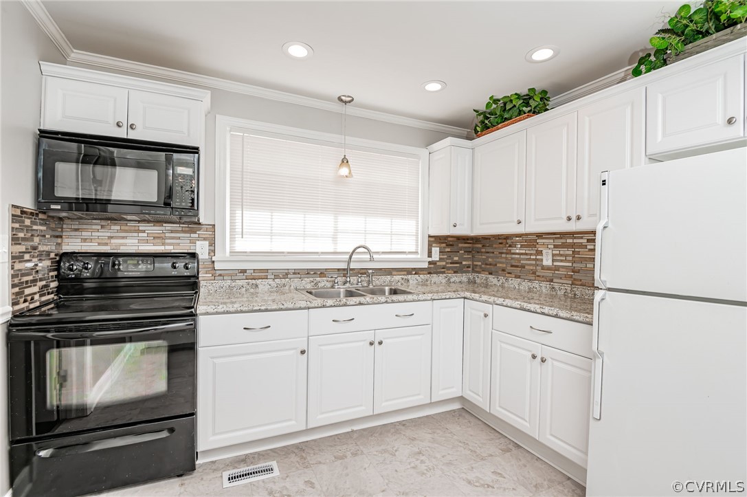 3825 West Hundred Road Chester, VA 23831 - Photo 8 of 30 a kitchen with granite countertop white cabinets white stainless steel appliances and sink