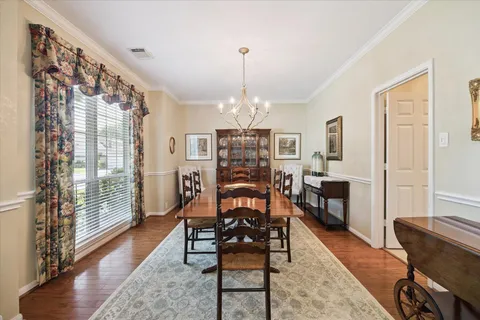 a view of a livingroom with furniture window and wooden floor