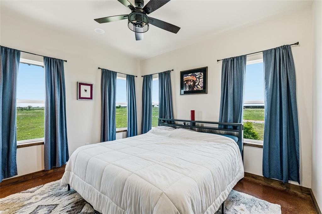 435 County Road 4875 Celeste, TX 75423 - Photo 16 of 35 a bedroom with a large bed and a window
