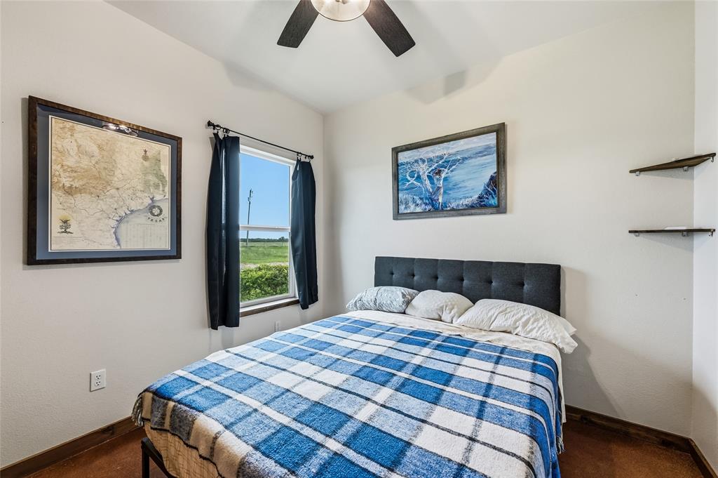 435 County Road 4875 Celeste, TX 75423 - Photo 20 of 35 a bedroom with a bed and a painting on the wall