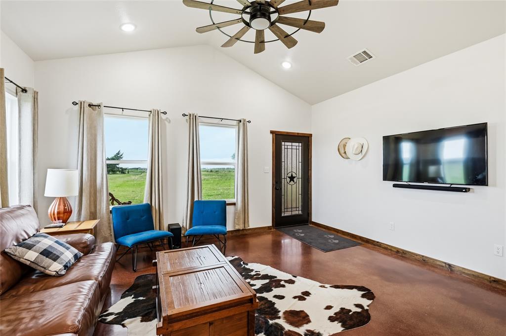 435 County Road 4875 Celeste, TX 75423 - Photo 10 of 35 a living room with furniture and a flat screen tv