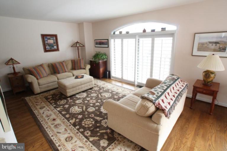 8111 Inverness Ridge Road Potomac, MD 20854 - Photo 2 of 17 a living room with furniture and a large window