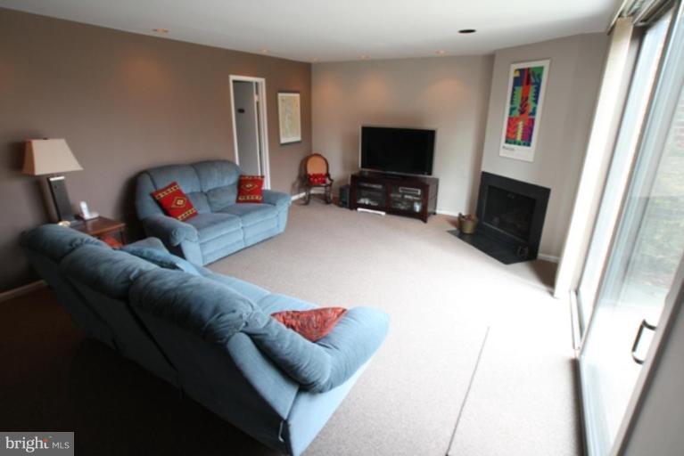 8111 Inverness Ridge Road Potomac, MD 20854 - Photo 12 of 17 a living room with furniture and a flat screen tv