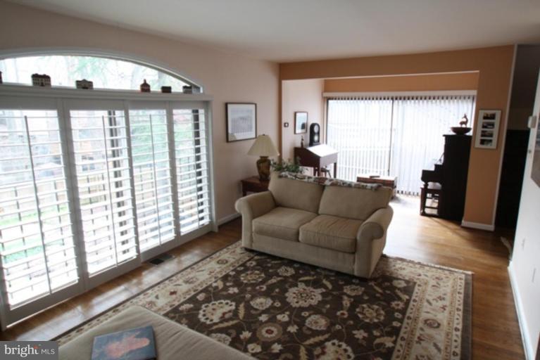 8111 Inverness Ridge Road Potomac, MD 20854 - Photo 3 of 17 a living room with furniture and a large window